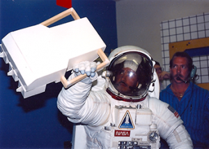 astronaut using mass spectrometer in EVA